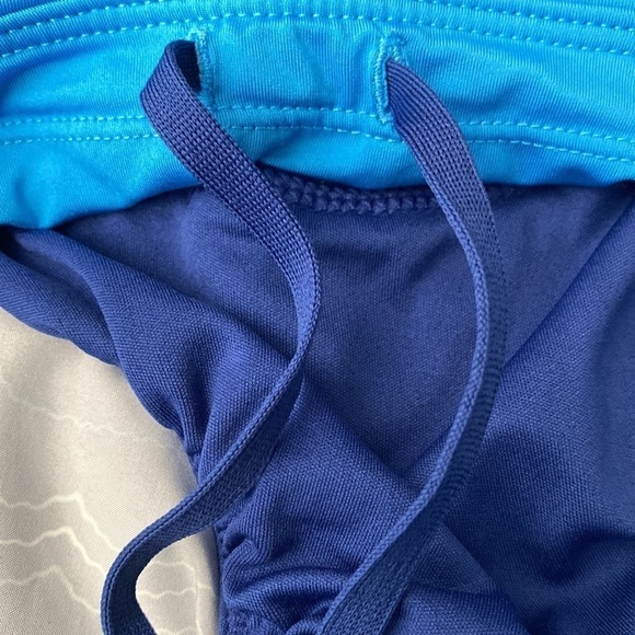 NIKE blue running shorts with small pocket and drawstrings. - Picture 8 of 9